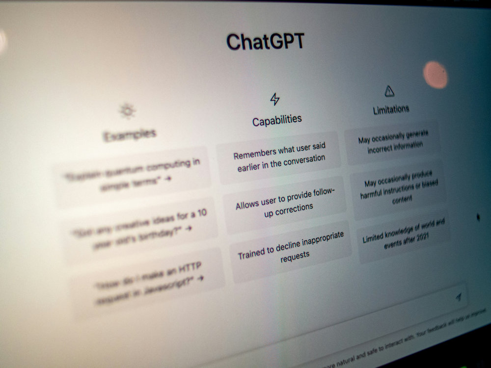 Person using a smartphone with digital chat overlay, representing AI chatbots and mental health apps.